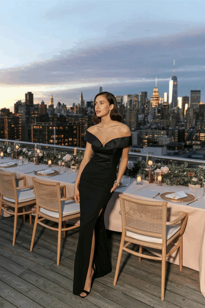 woman in a black tie off-the-shoulder gown