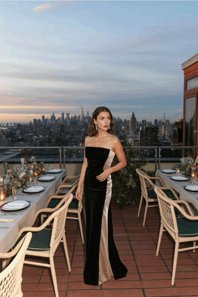 woman wearing a black tie gown with a velvet side panel
