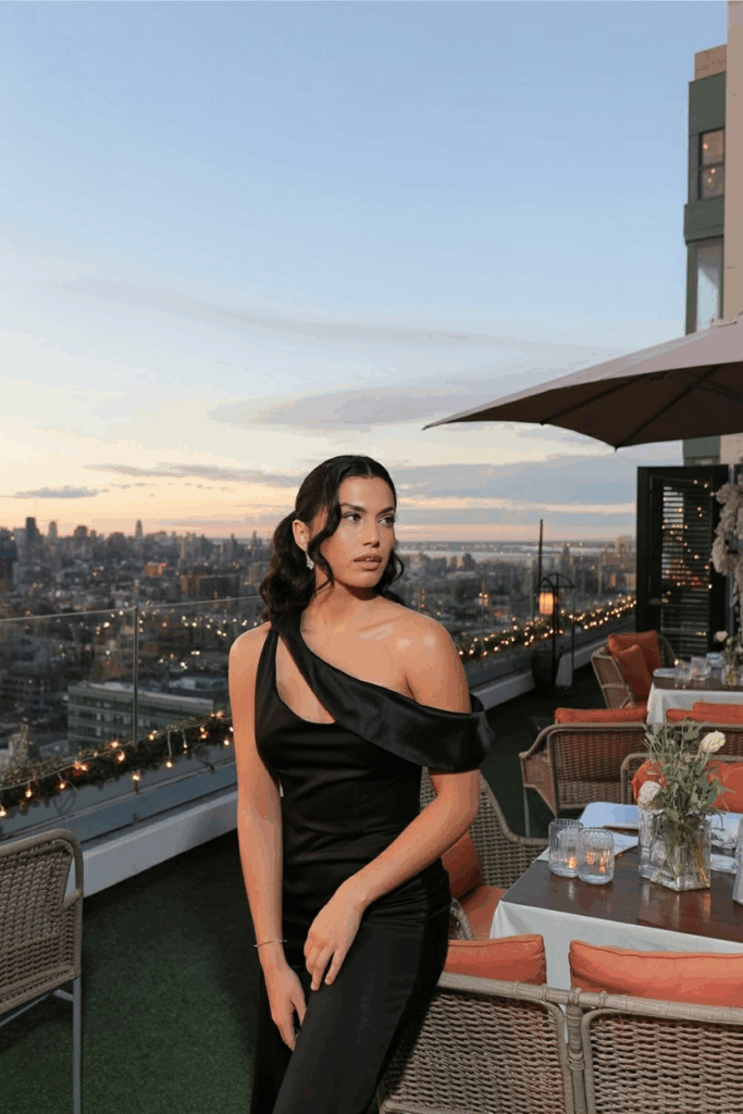 woman in a black tie one shoulder gown