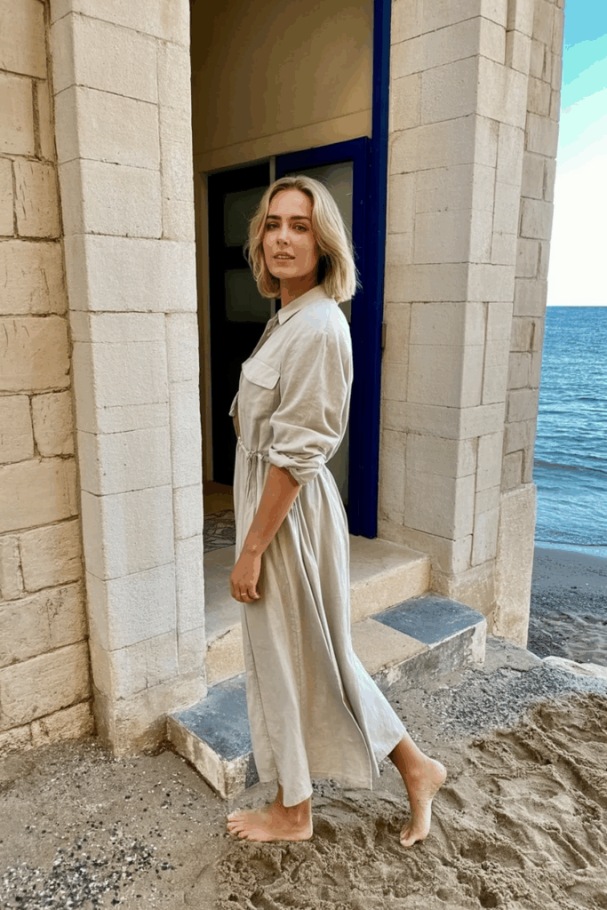 a woman in a flowing neutral dress 