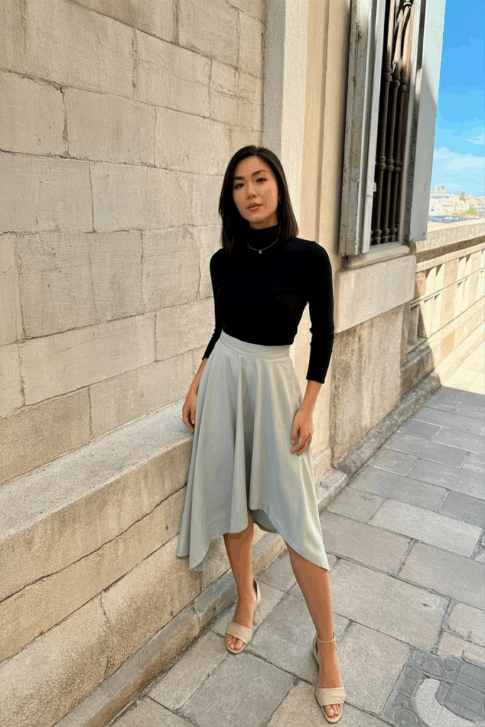 woman wearing a muted pastel midi skirt with an asymmetrical hem