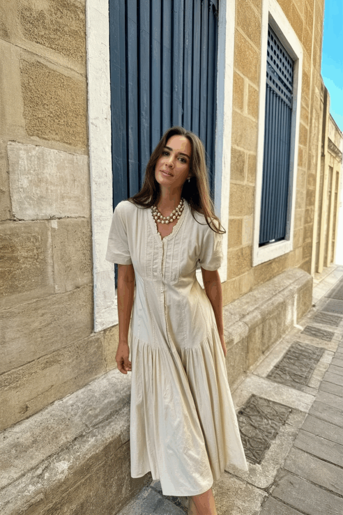 a woman wearing a Tea-length dress