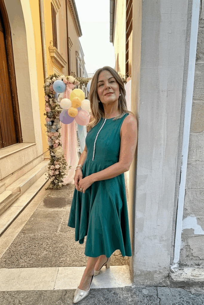 a woman in her 50s wearing an A-line dress