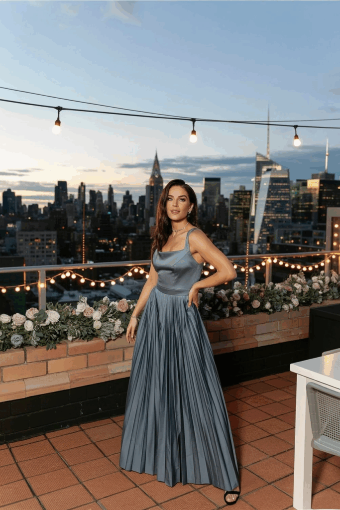 woman in a black tie A-line dove gray gown with soft pleats
