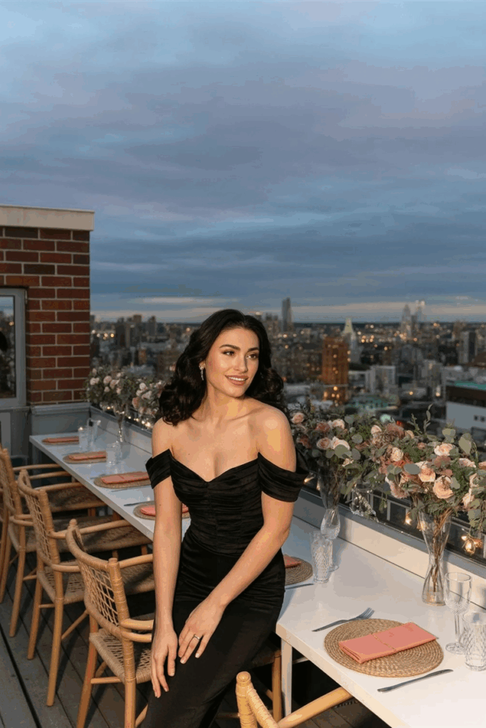 woman in a black tie off-the-shoulder gown
