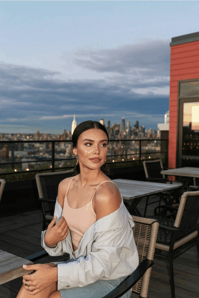 woman with natural makeup: dewy skin, soft blush, balm-glossed lips,